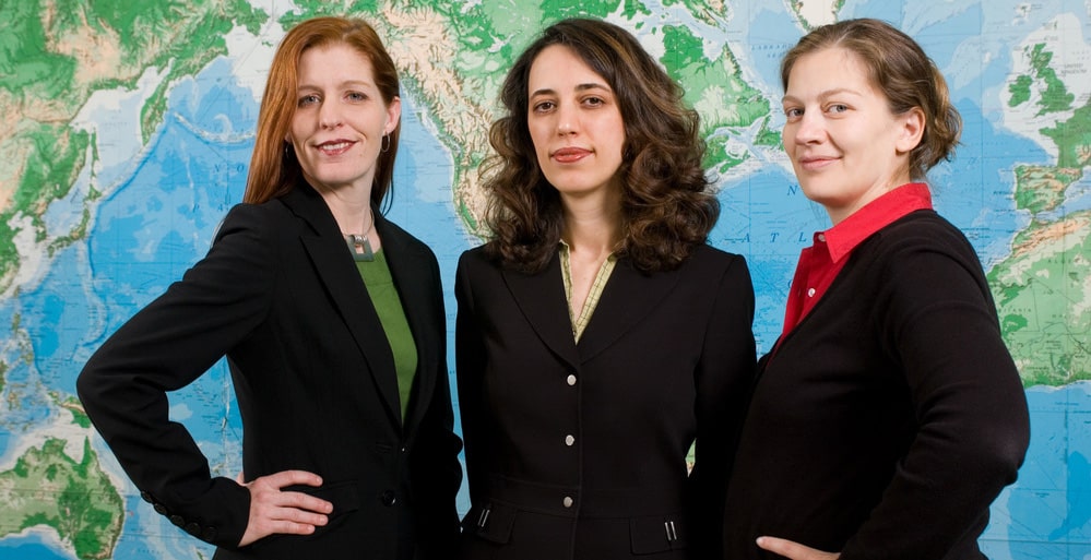 Students standing in front of a map