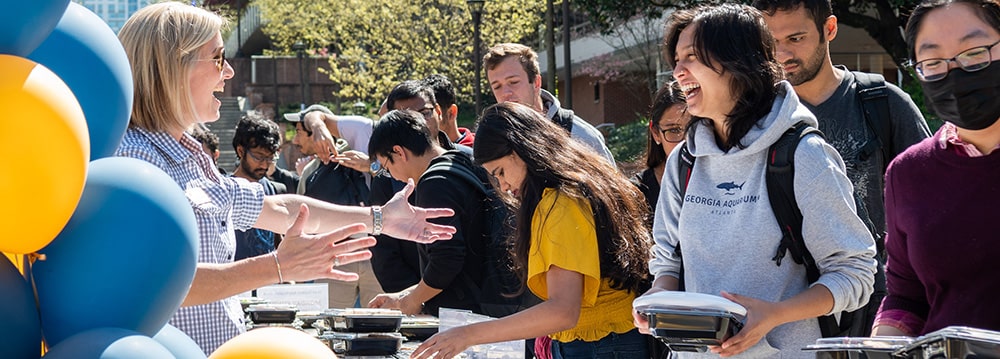 Grad students picking up boxed lunches at Grad Student Appreciation Week