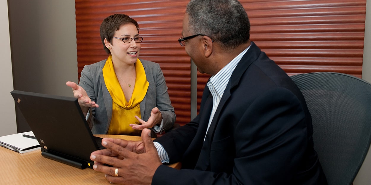 Career advisor speaking with student